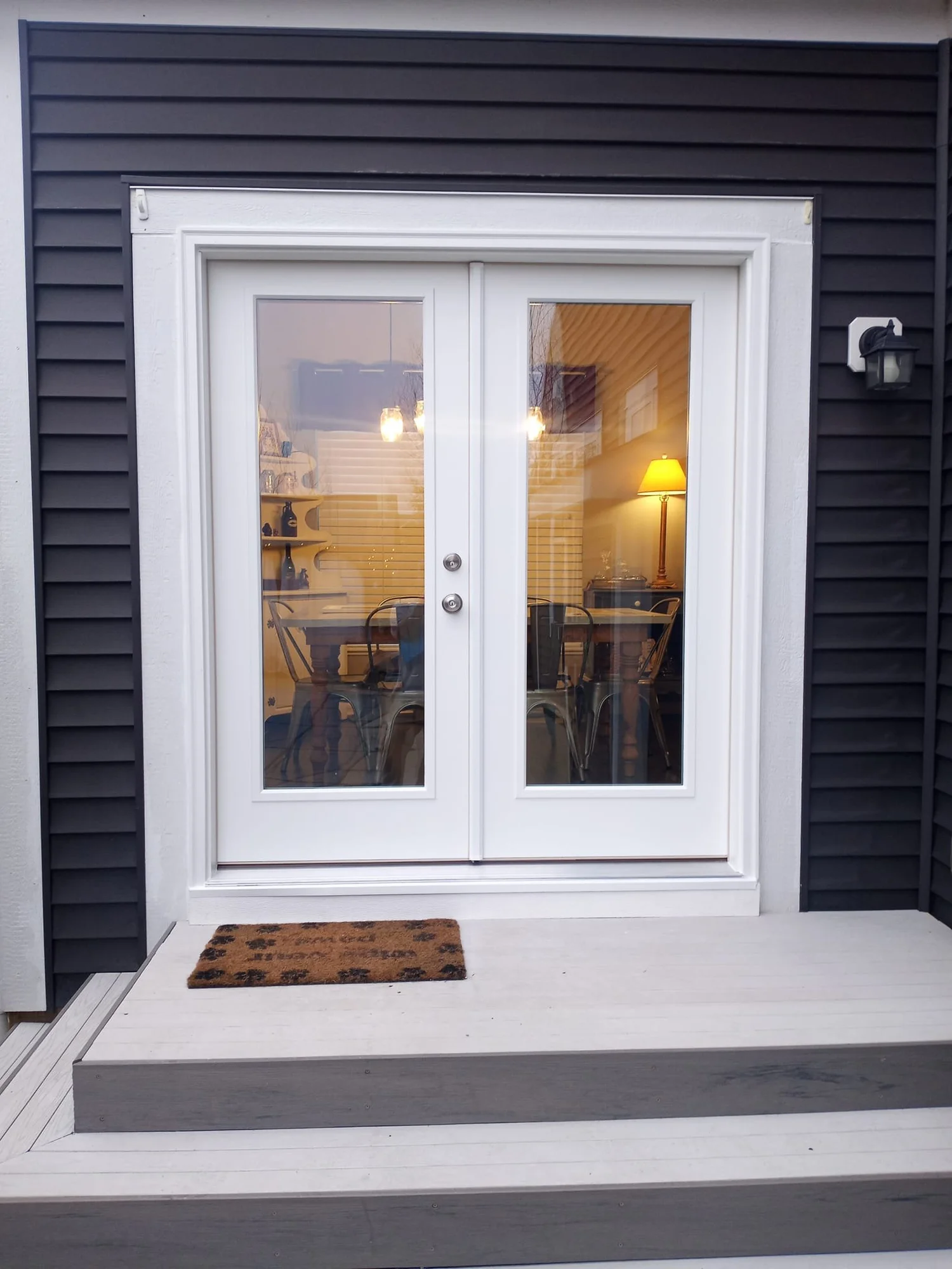 Exterior view of white double-hung windows.